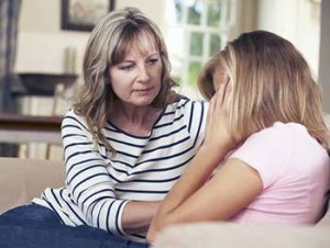 Adult woman counseling a girl